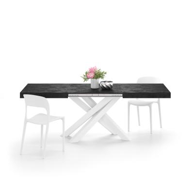 Mesa extensible Emma 140, color cemento negro, con patas cruzadas blancas